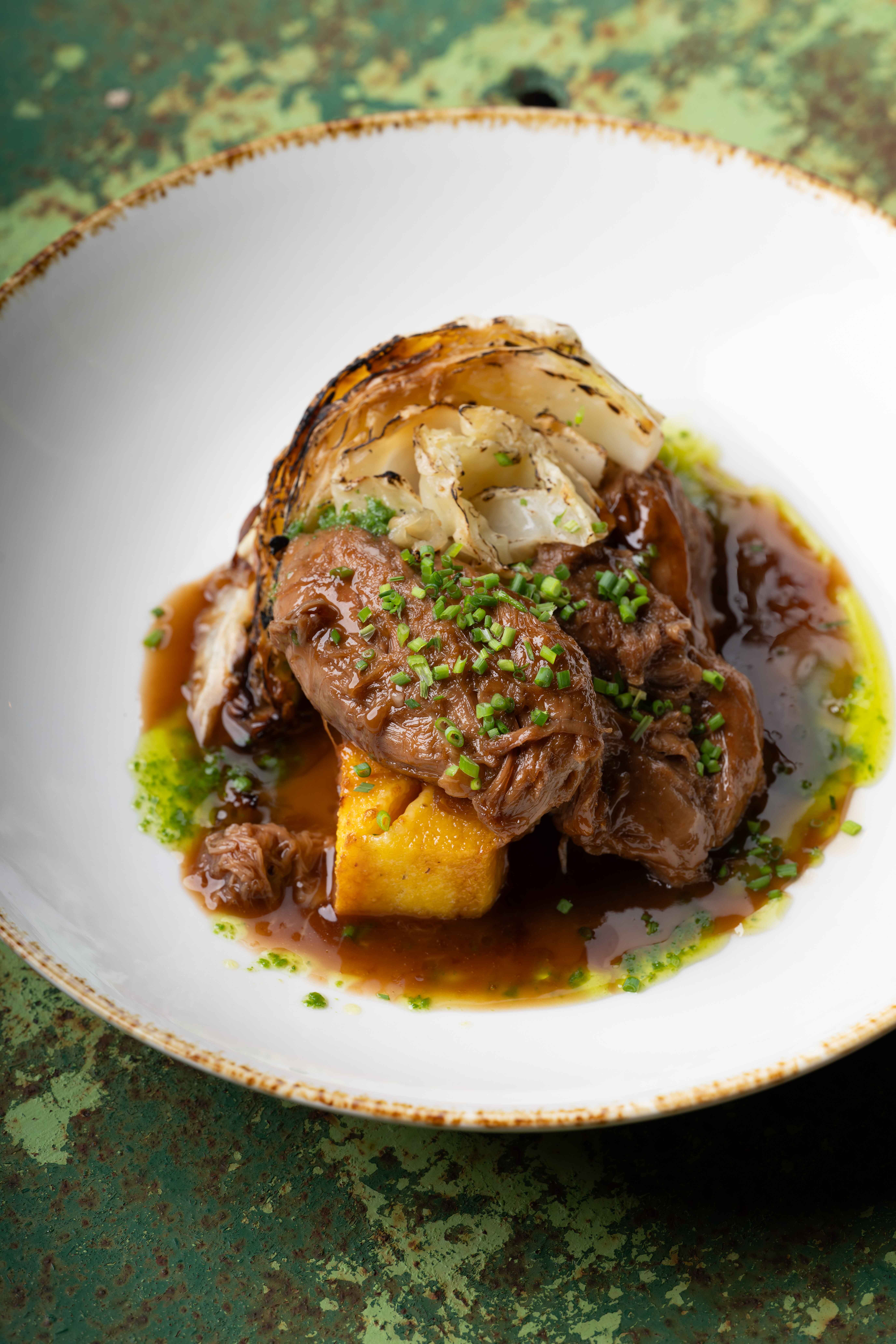 Lamb ragout with maslegija cheese and baked cabbage